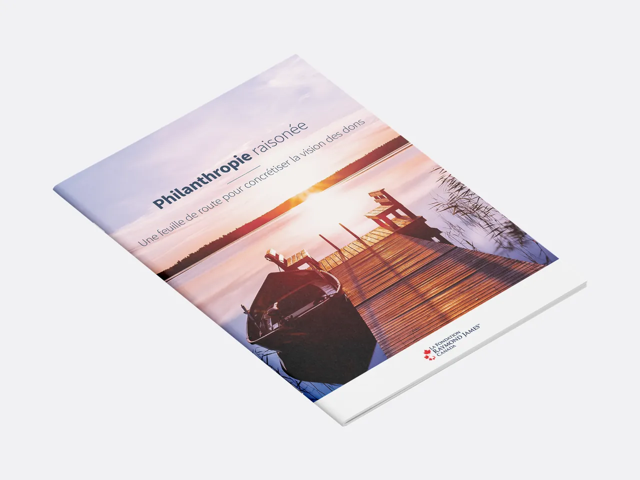 French cover with a dock and rowboat at sunset.
