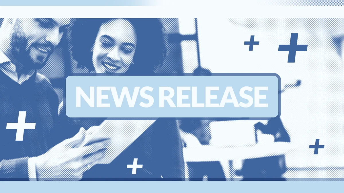 Blue-toned news release banner with white text on a pale blue band, over a photograph of two smiling people, with white plus signs.