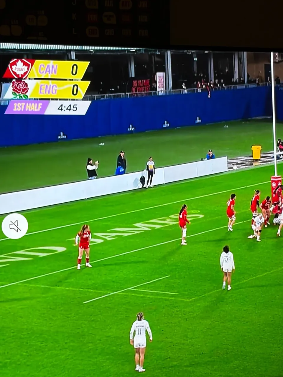 Broadcast frame of the match showing the graphics along the pitch.