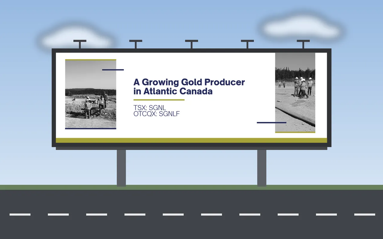 A roadside billboard displaying a wide banner for a gold producer.
