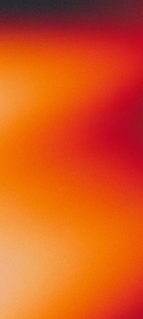 Soft grainy gradient in glowing orange and deep red, dark at the top and pale peach at the bottom left.