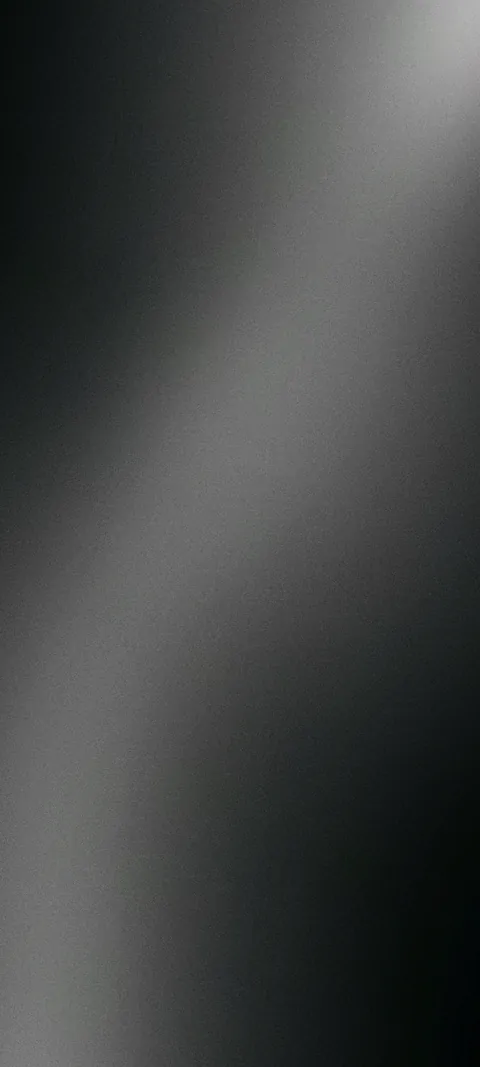 Soft grainy gradient in black and grey, with a light grey band curving down the middle.
