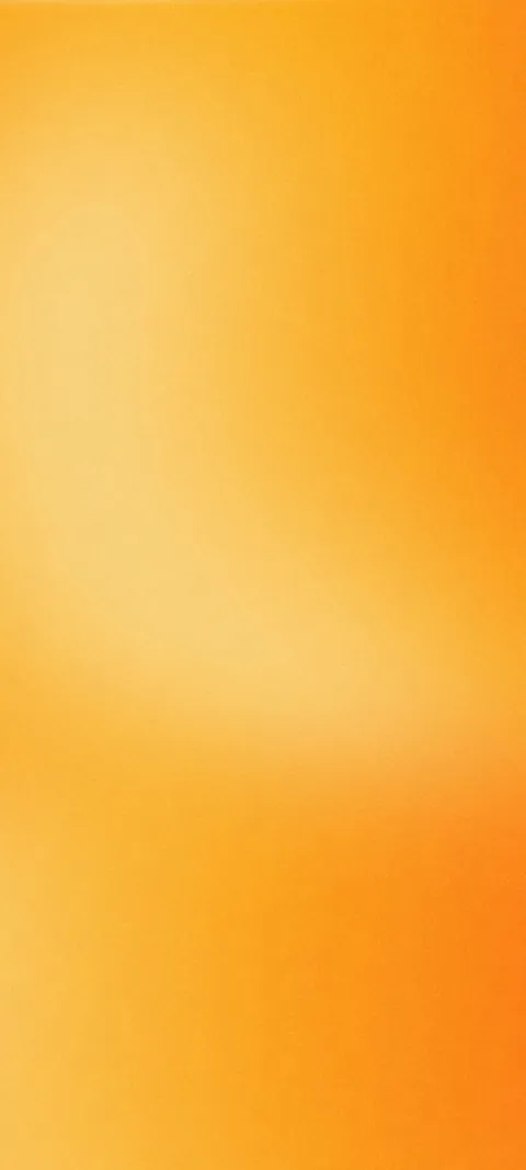Soft grainy gradient in warm yellow and orange with a pale glow in the upper middle.