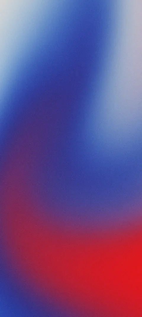 Soft grainy gradient with a blue swirl over red at the bottom and a pale grey-blue top corner.